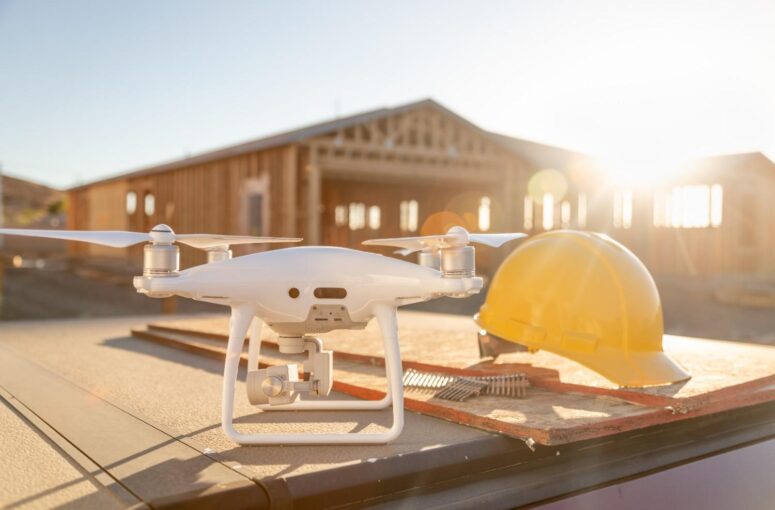 drone-quadcopter-next-to-hard-hat-helmet-at-constr-2026-01-05-00-26-09-utc (1)