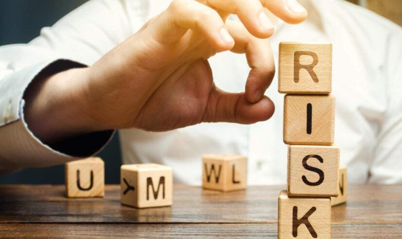 hand-removes-blocks-with-the-word-risk-2026-01-08-23-28-03-utc (1)