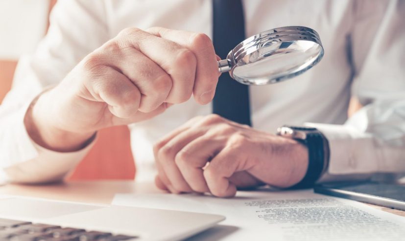 cautious-businessman-reading-contract-agreement-wi-2026-01-07-00-13-29-utc (1)