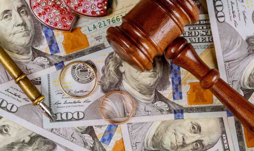 close-up-of-wedding-rings-and-judge-gavel-on-ameri-2026-03-24-23-53-54-utc (1)