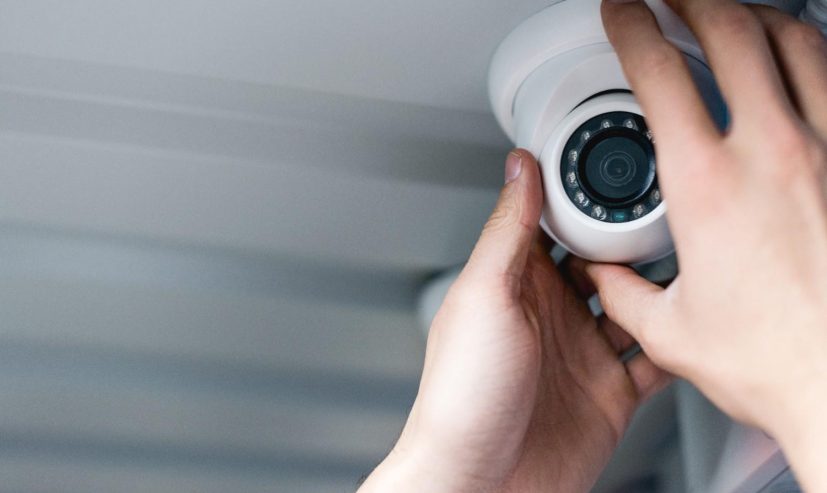 cropped-view-of-man-setting-up-security-camera-2026-03-12-23-54-04-utc (1)